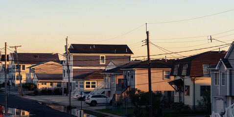 Power lines and shore houses at sunrise on the New Jersey shore.