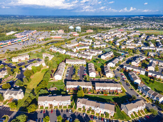 Aerial views of residential area, roads, parks and shopping areas.