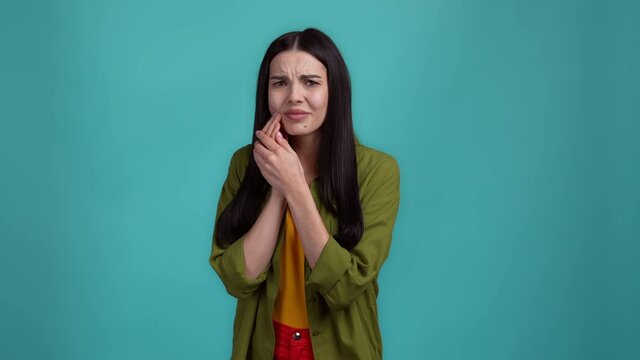 Upset lady struggle teeh ache isolated dark cyan color background