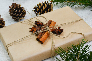 eco friendly merry christmas gift in craft paper wrapping, zero waste reusable concept, natural decor and sustainable lifestyle no people