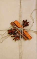 eco friendly merry christmas gift in craft paper wrapping, zero waste reusable concept, natural decor and sustainable lifestyle no people