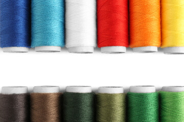 Set of colorful sewing threads on white background, flat lay. Space for text