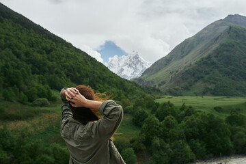 Woman outdoors in the mountains travel landscape nature