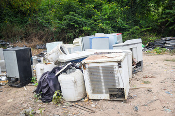 Electronic waste ready for recycling, Pile of used electronic and housewares waste division broken...
