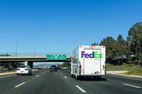 FedEx Ground delivery vehicle is running on highway - Los Angeles, California, USA - 2021