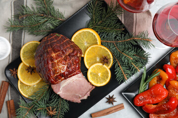 Fototapeta na wymiar Festive flat lay composition with delicious ham on grey table. Christmas dinner