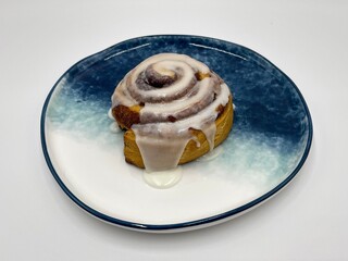 Delicious hot cinnamon roll with icing 