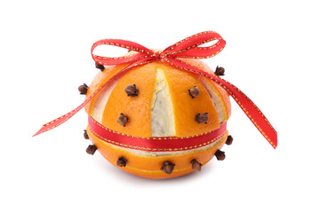 Pomander ball with red ribbon made of fresh tangerine and cloves isolated on white