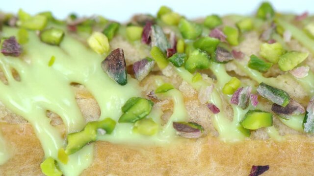 White eclair dessert with fistic nuts and cream