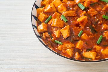 Mapo Tofu - The traditional Sichuan dish of silken tofu and ground beef, packed with mala flavor from chili oil and Sichuan peppercorns.