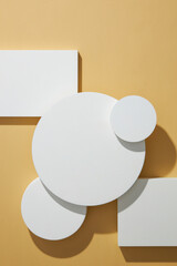 Top view of circle , square white podium ,  in light brown background and blank space for...