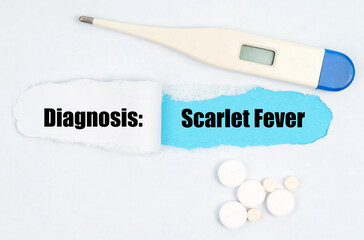 Medical diagnosis. On paper a thermometer, pills and a hole, inside which the inscription - Scarlet Fever