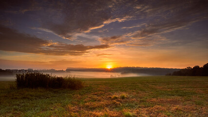 Golden sunrise over a field in North Carolina.