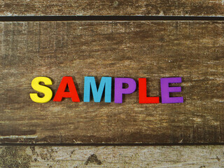 sample wording colorful wooden on wood background
