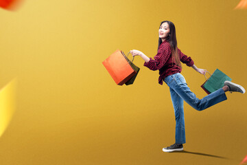 Asian woman carrying shopping bags