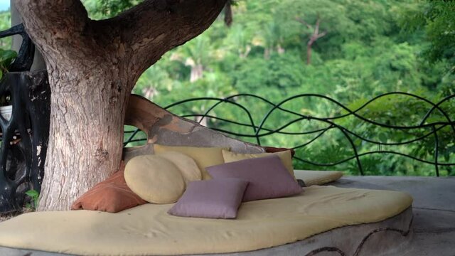 Relaxing retreat in the jungle paradise of a tropical rainforest with pad and pillows to rest on