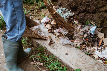 young volunteers keep the environment clean by picking up trash