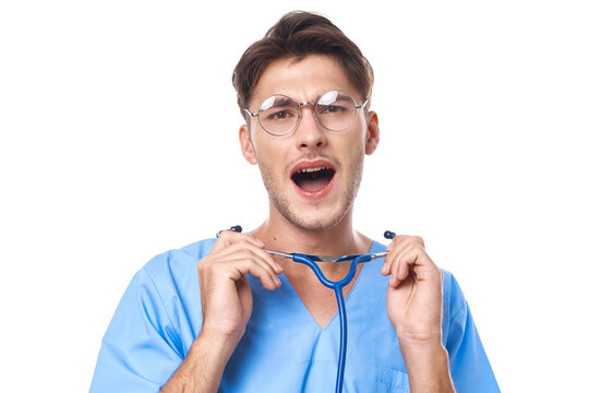 man in medical uniform wearing glasses stethoscope posing light background
