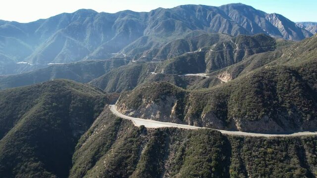 Southern California Mountain Pass outside of Los Angeles, San Bernardino County Angeles Crest Scenic winding mountain pass road in Summer with Mountains and cars driving to mountains