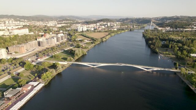 Pedro e Ines pedestrian bridge on Mondego river at Coimbra, Portugal. Aerial panoramic view
