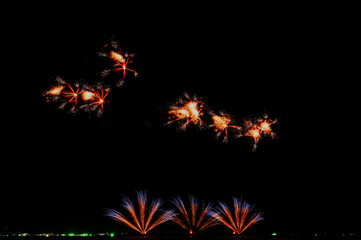 Beautiful Fireworks on the sky background. New year concept 2022.
Fireworks festival 2021 on the beach at Pattaya in Thailand.