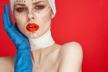 woman Red lips plastic surgery operation bare shoulders red background