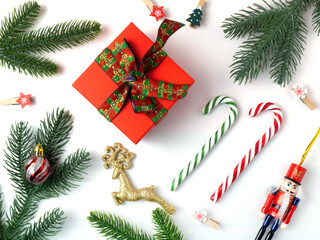 Christmas holiday background with board and decorations, gift boxes on the gray textured board View from above