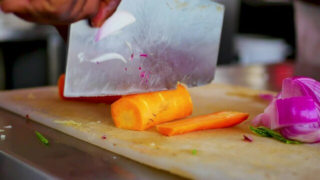 African American Chef Chopping Carrots
