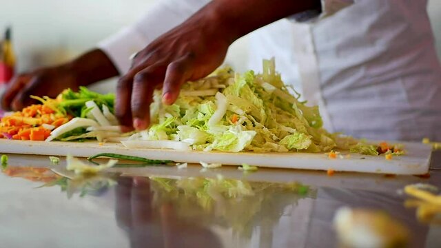 African American Chef Chopping Cabbages