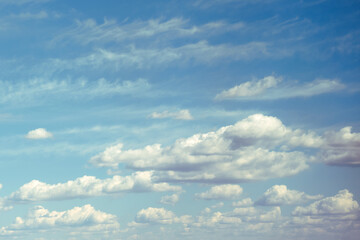 Fototapeta na wymiar Cloudy sky background on a clear sunny day, copy space