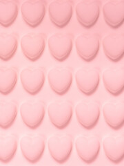 Pink hearts wallpaper background. Pink 3D hearts on pink background. Happy Valentines Day. Texture with three-dimensional hearts. Copy space. Place for your text.
