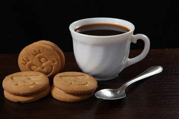 cup of coffee with cookies