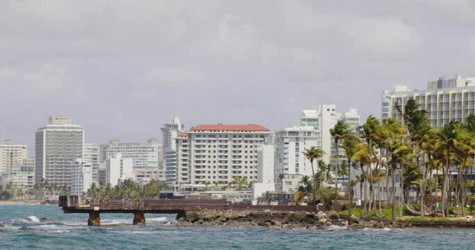 View across El Boqueron Bay on sunny day toward buildings of Condado Beach, San Juan, Puerto Rico.