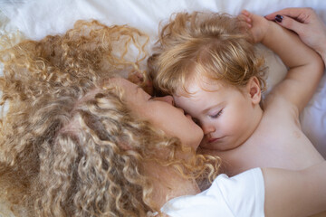 Mother and baby child sleeping together. Sweet dreams and kids sleep.