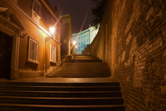 Romantic alley leading to the castle, city at night