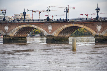 Bordeaux, France - 8 Nov, 2021 Pont de Pierre bridge, over the Garonne river in Bordeaux, Nouvelle Aquitane, Gironde