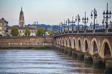 Bordeaux, France - 8 Nov, 2021 Pont de Pierre bridge, over the Garonne river in Bordeaux, Nouvelle Aquitane, Gironde