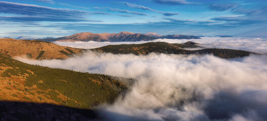 Beautiful sunrise. Clouds over the mountains. Autumn Landscape