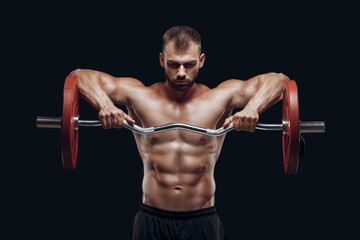 Front view of a strong man bodybuilder lifting a barbell isolated on black background