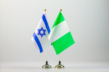 State flags of Israel and Nigeria on a light background.