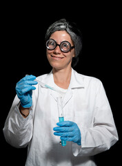 Crazy chemist woman with disheveled hair and vial in hands