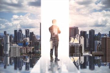 Fototapeta premium Creative image of male standing on city background. Success, growth and future concept. Double exposure.