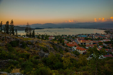 FETHIYE, TURKEY: Top view of the Turkish city of Fethiye in the evening.