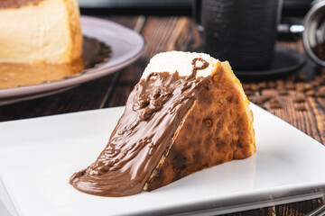 Fototapeta premium San Sebastian Cheesecake with Chocolate Poured on it