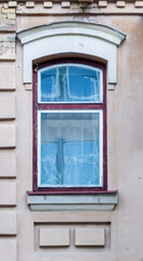 Fototapeta na wymiar Arched window in plastered wall