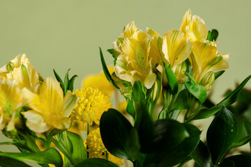 Beautiful yellow and green Bouquet of lilies and chrysanthemums