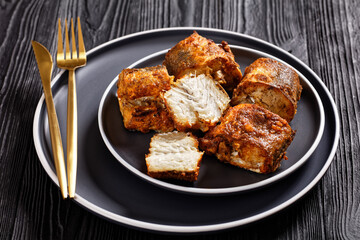 fried pieces of hake on a plate
