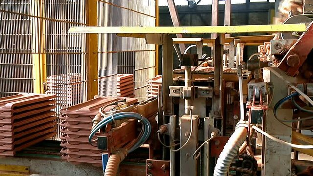 Roof Tiles Production Line ; Production line of a modern factory for making roof tiles