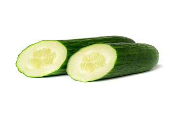 Two halves of a green cucumber isolated on a white background