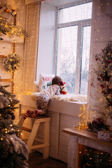 little boy christmas looking st the window